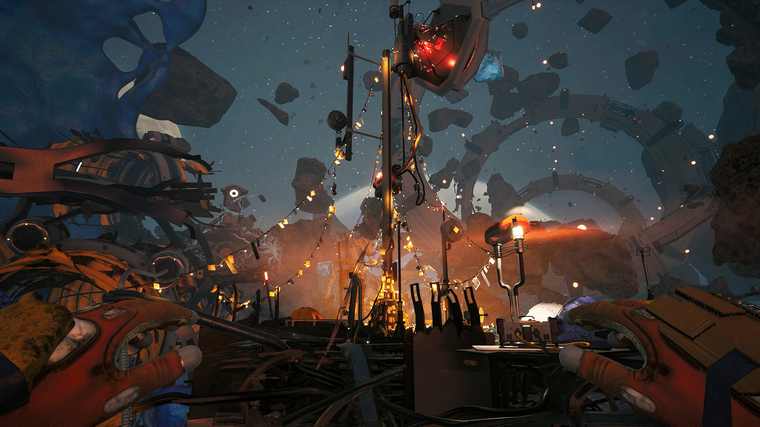A mast strung with lights and bunting stands in a debris field at night, a red beacon on top, the Man's gloved hands in the foreground